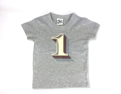 First Birthday Kids' T-shirt - Stirling Shadow Baby Clothes, Font Not Found, Font: Stirling Shadow, New Baby, T-Shirt: Numbers, T-Shirts 44ideas.co.uk
